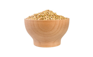 raw buckwheat in wooden bowl isolated on white background. nutrition. food ingredient.front view.