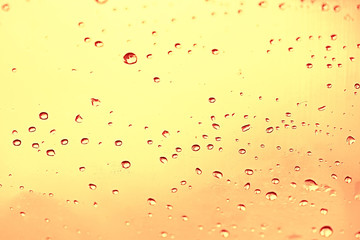 yellow tinted glass drops / abstract background texture