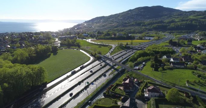 Train MVR crossing highway, direction St-L&eacute;gier - Aerial 4K