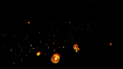 Sky Lanterns being released in the the Sky off of Nawarat Bridge in Chiang Mei, Thailand. Celebrating Yi Peng the lunar new year. Sky Lanterns joining the amass above.