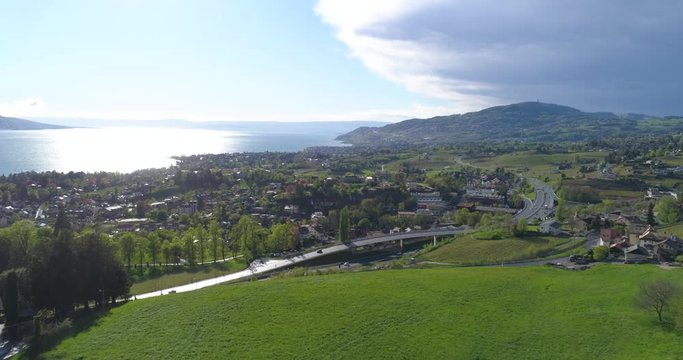 Fly up over Montreux highway, Birds passing - Aerial 4K