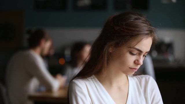 Upset offended millennial girl student in cafe feeling lonely excluded