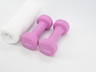 Fitness equipment with dumbbells and towel isolated on a white background. Healthy with exercise concept.