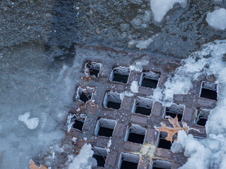 frozen drain along street