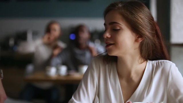 Millennial guy get acquainted talking to pretty girl in cafe