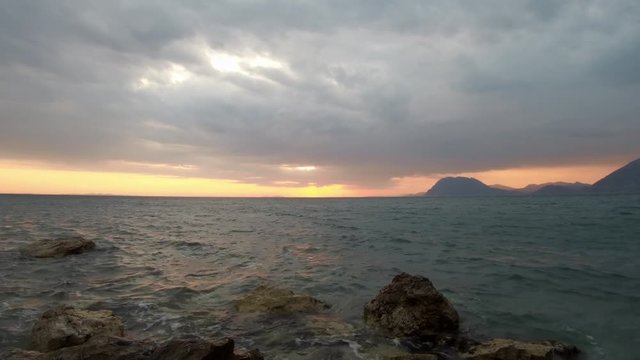 Sunset view from Patras Greece. Cloudy weather, winter atmosphere.