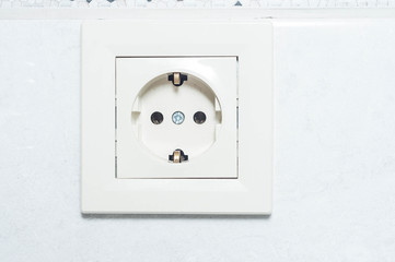 Installing the outlet in the apartment on a white wall