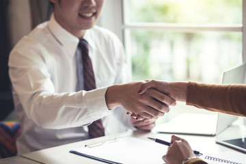 Successful businessman handshake at meeting. Congratulations and Confirmation in the agreement investment together.