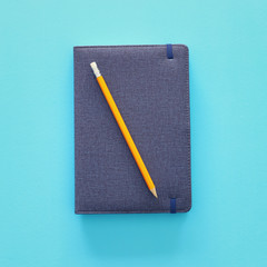 notebook cover over blue background. Top view flat lay