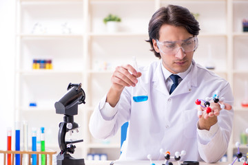 Young male scientist working in the lab 