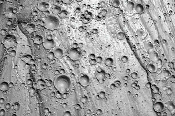 Small craters in mud volcanoes's clay river. Buzau county, Romania.