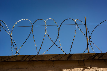 Barbed wire on a stone fence