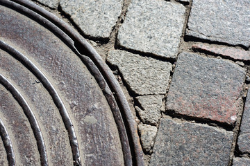 Part of the sewer on the paving stone