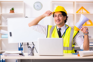 Male construction engineer working in the office 
