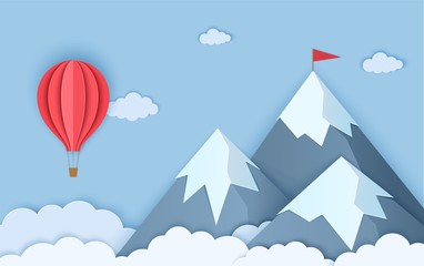 Mountains in paper cut style. Landscape with clouds of three snow capped mountains and a flying red hot air balloon. Vector origami card illustration