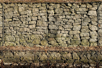 Stones behind iron mesh abstract background