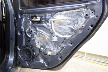 Installation of sound insulation material on the car.