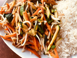 Crunchy, healthy, roasted vegetables - zucchini, bean sprouts, carrots, peppers and basmati rice.