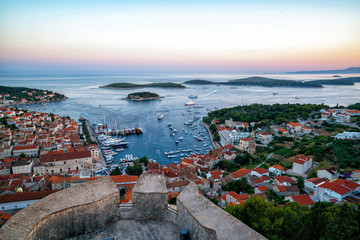 Panoramic view of Hvar Town in Croatia. Hvar Town is the famous town for summer beach vacation on Hvar Island in Dalmatia, Croaita. - obrazy, fototapety, plakaty