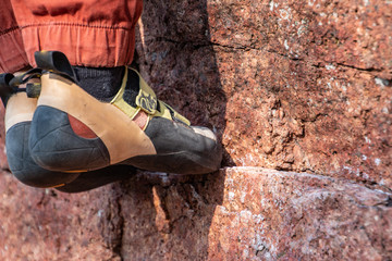 Toes on climbing hold outdoors