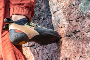 Toes on climbing hold outdoors
