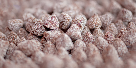 Candy in large quantities. Piled up and in order.