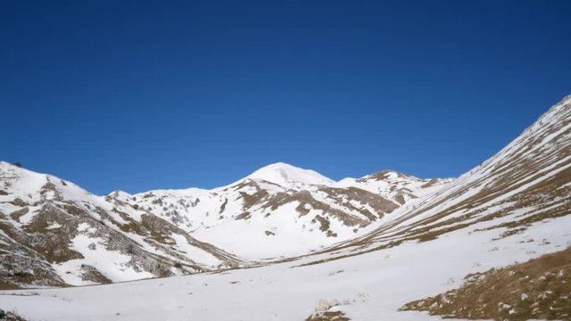 Campo dell'esule (Field of the exile), Campo dell'arco (field of the arch). Snow covered plateau with blue sky. Landscape of Matese Mountain National Park. Matese Lake, Caserta, Italy