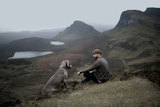 Man and a dog in the mountains