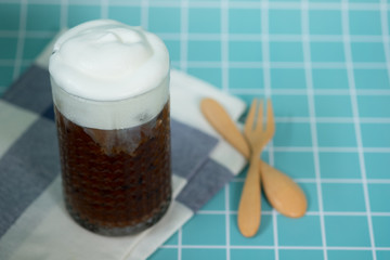 Iced coffee in glasses with milk and cream