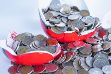 Destroyed piggy bank for savings. Coins for saving. Destroyed piggy bank For storage, investment, education and the future.