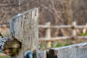 Detail of old rural fencing with shallow focus on single fence post
