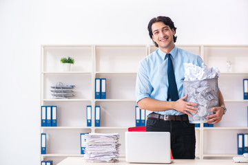 Businessman rejecting new ideas with lots of papers