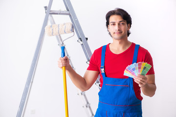Young handsome contractor working indoors 