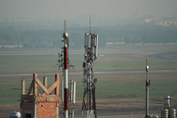 Telephone antenna on roof top of building