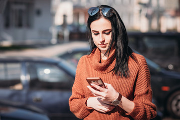 Woman in city street use smartphone