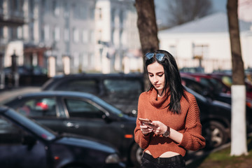 Woman in city street use smartphone