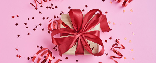 Gift box with bow and confetti, web banner