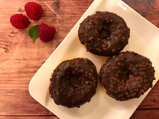 Dessert with donuts and raspberries.