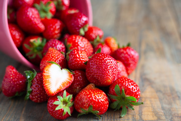 Fresh strawberries on wooden table.