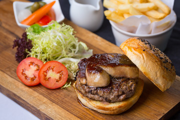 burger with french fries and salad