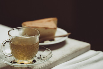 cup of tea and cake on wooden table