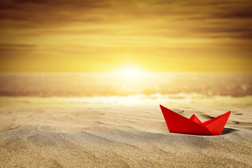 Summer photo of beach and small ship in sand 