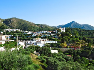 Fototapeta na wymiar Sunny view of picturesque mountain village on Crete, Greece..