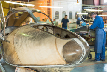 the skeleton of the aircraft on the construction and plant. Worker creates a plane. Airship Nose....
