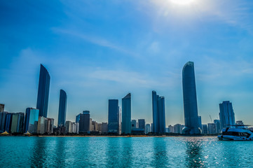 Fototapeta premium Abu Dhabi city skyline along Corniche beach taken from a boat