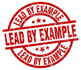 lead by example round red grunge stamp