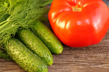 Bright vegetables on a wooden cracked board.