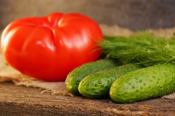 Bright vegetables on a wooden cracked board.