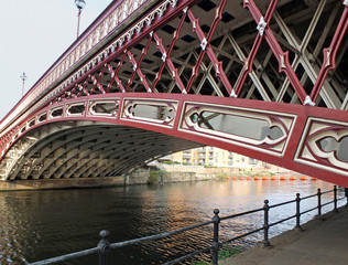the historic 19th century crown point bridge crossing the river aire in leeds