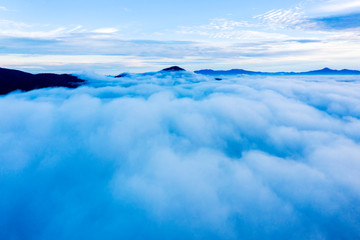 Beautiful clouds above mountains at morning